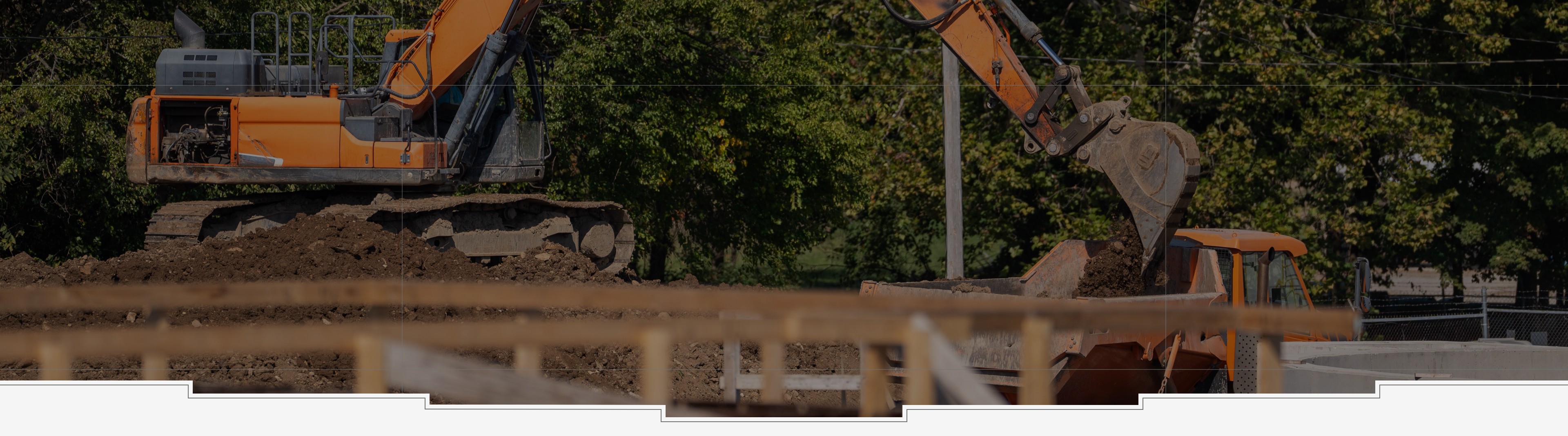 James S. Jackson Company working at construction site with heavy equipment.